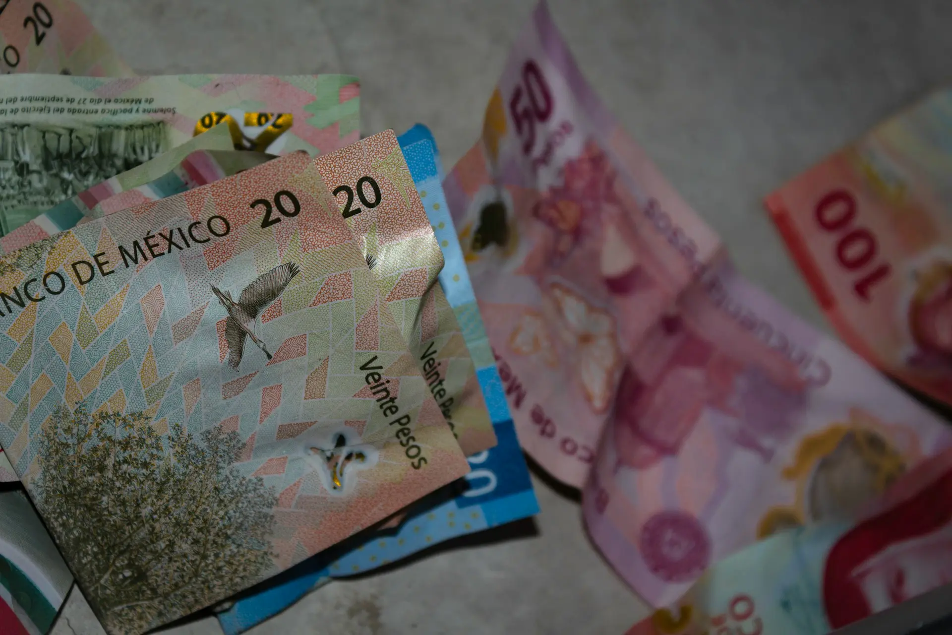 A pile of money sitting on top of a table